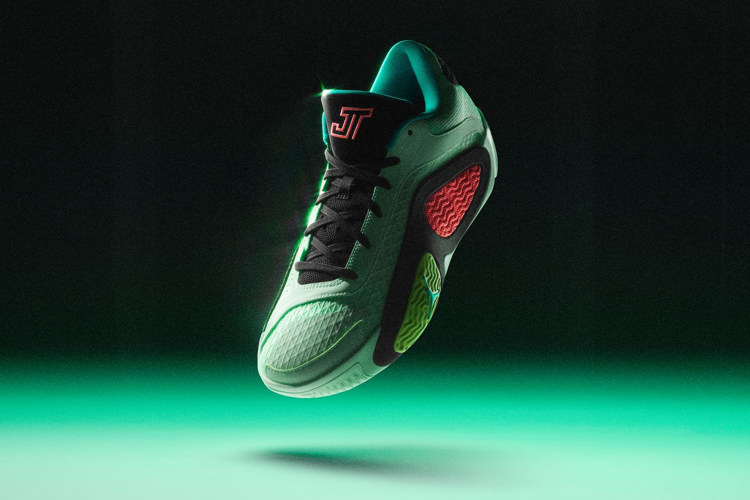 Side view of Jayson Tatum's green and black Jordan Brand shoe.